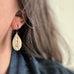 textured teardrop earrings on model