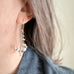 lily of the valley earrings all handmade in sterling silver, as shown on model