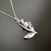 hand made sterling silver lily of the valley pendant on a sterling silver adjustable length chain.