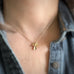 14k gold-filled shamrock necklace as shown on model