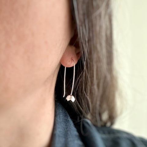 simple tulip shaped sterling silver earrings shown on model